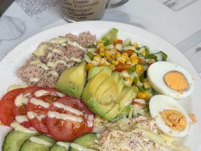 Fresh salad plate with tuna, avocado, egg and vegetables at Laura's Little Cafe