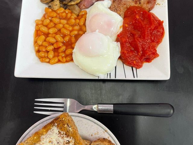 Freshly cooked bacon, eggs, beans, mushrooms and tomatoes at Laura's Little Cafe